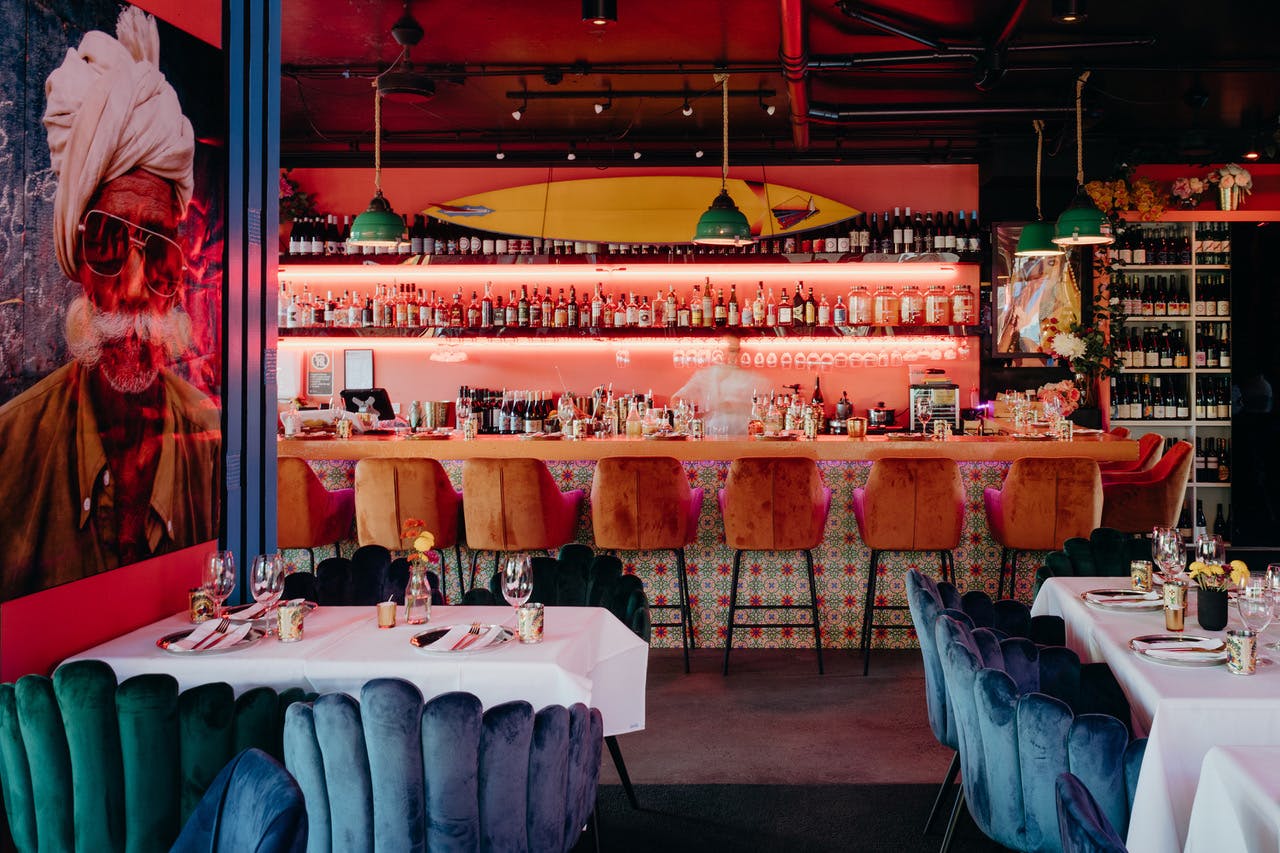 the interior of a vibrant indian restaurant